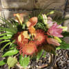 Bouquet with pink calla lilies and orange pincushion blooms