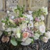Soft pink and white mixed bouquet in a white vase