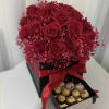 An elegant box filled with rich red roses at their peak, finished