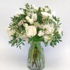White rose bouquet in a clear glass vase