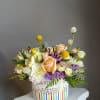 A rich, garden-style arrangement that reads romantic and joyful at once-perfect as