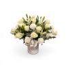 A calm, refined display of white roses and lilies, the Light of