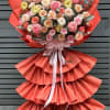 Peach and blush roses take center stage in this Fresh Start Bloom