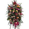 This bright and elegant sympathy piece features gladiolas, roses and more in