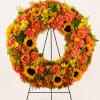 This elegant sympathy wreath is designed to offer warmth, comfort, and remembrance.