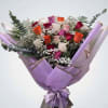 Bouquet of multicolored roses wrapped in lavender paper