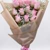A compact cluster of bright pink roses makes an immediate, romantic impression-perfect