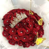 Red rose bouquet with a jeweled tiara and yellow butterfly decorations