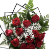 Bouquet of red roses with white baby's breath and fern foliage