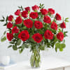 Bouquet of red roses in a clear glass vase