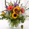 A burst of sunny joy-this mixed flower bouquet brings together bold sunflowers