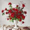 An opulent expression of love unfolds in deep,passionate hues,arranged with effortless grace