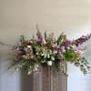 A lush and natural mix of seasonal blooms and greenery to celebrate
