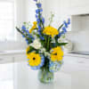hydrangeas gerbera daisies roses and delphinium. Tall arrangement 26 in height 