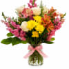 A joyful arrangement with mix blooms, colors and textures. Perfect for everyday