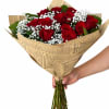 A timeless dozen roses with baby&rsquo;s breath, wrapped in a rustic elegant