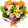 A cheerful hand-tied bouquet featuring soft peach roses, sunny yellow daisies, delicate