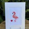 Flamingo cross-stitch card on a clear stand