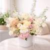 Soft cream and blush roses paired with pink hydrangeas make this baby