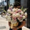 Creamy white hydrangeas and blushing pink roses take center stage in this