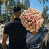 A lush dome of pale pink roses-each bloom graduating from soft blush