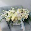 A serene, garden-fresh statement, this large low basket arrangement-ideal as a sympathy