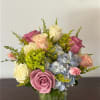 A beautiful and vibrant floral arrangement in a harmonious blend of blue