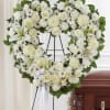 A graceful heart-shaped sympathy wreath that brings calm and reverence to a