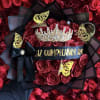 Bouquet of red roses with a jeweled crown and black ribbon
