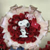Bouquet of red roses with a Snoopy Valentine topper