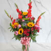 A bold, tropical-inspired arrangement designed with rich and vibrant tones. This piece