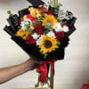 Inspired by everyone&rsquo;s favorite bear, this graduation bouquet blends warm sunflowers, beautiful