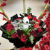 Bright, bold, and full of celebration! This graduation bouquet combines elegant red
