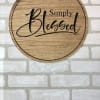 Round wooden sign reading 