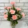 A dozen carnations *available in pink, red, and white.*