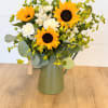 Sunflowers and fill in a beautiful green watering can.
