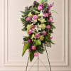 Soft and elegant, this standing spray is thoughtfully designed to honor a