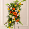 Celebrate a life lived beautifully with Golden Tribute, a vibrant standing spray