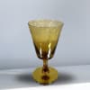 Amber glass goblet with a wide bowl and short stem