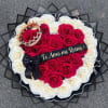 Heart-shaped red and white rose arrangement with crown and Spanish love message