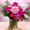 Vivid magenta roses set the tone in this birthday and anniversary flower