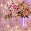 Fresh blush and soft pink roses accented with coordinating seasonal flowers, selected