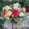 Bouquet of coral, pink, and white flowers with greenery