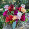 Mixed bouquet of pink, coral, and cream flowers