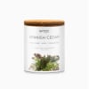 Scented candle in a glass jar with a wooden lid