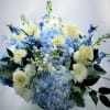 Blue hydrangea bouquet with white roses and pale daisies