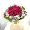 Bouquet of hot pink roses with white accent flowers
