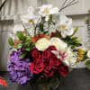 Pink orchids, hydrangeas, and the designer's choice give this result to impress.

