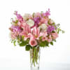 Pink and white mixed bouquet in a clear glass vase