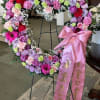 A heart-shaped crown made of fresh flowers, ideal for expressing eternal love